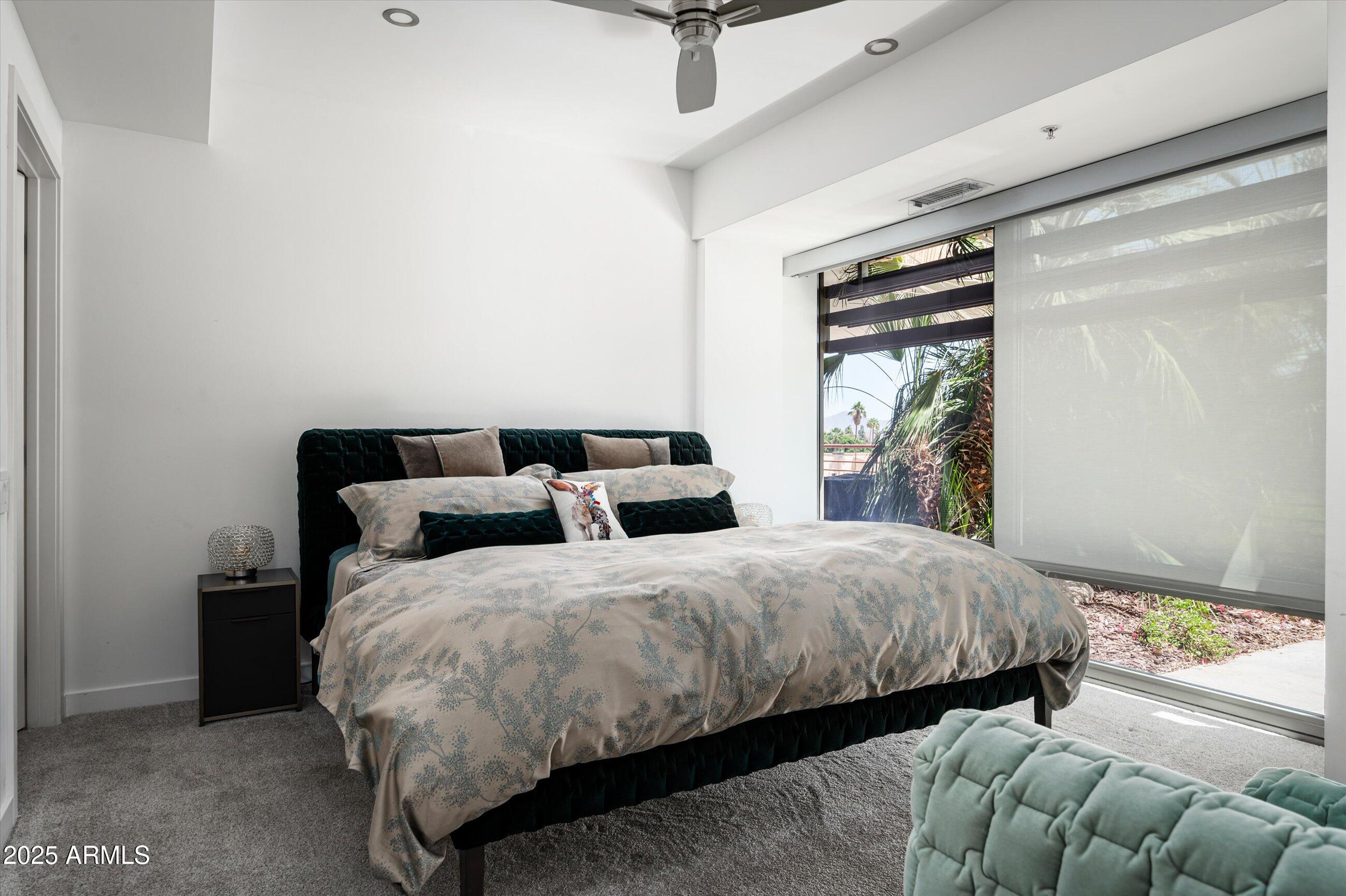 7167 East Rancho Vista Drive, Unit 4010 Scottsdale, AZ 85251 - Photo 11 of 43 a bedroom with double bed and a window