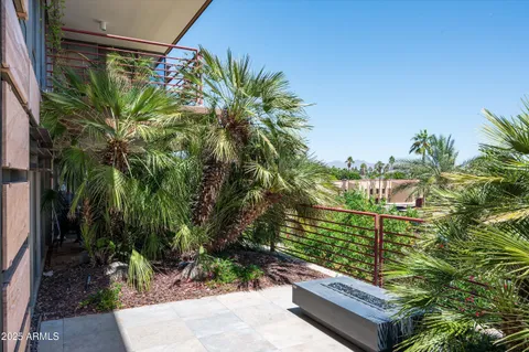 a view of a backyard with sitting area