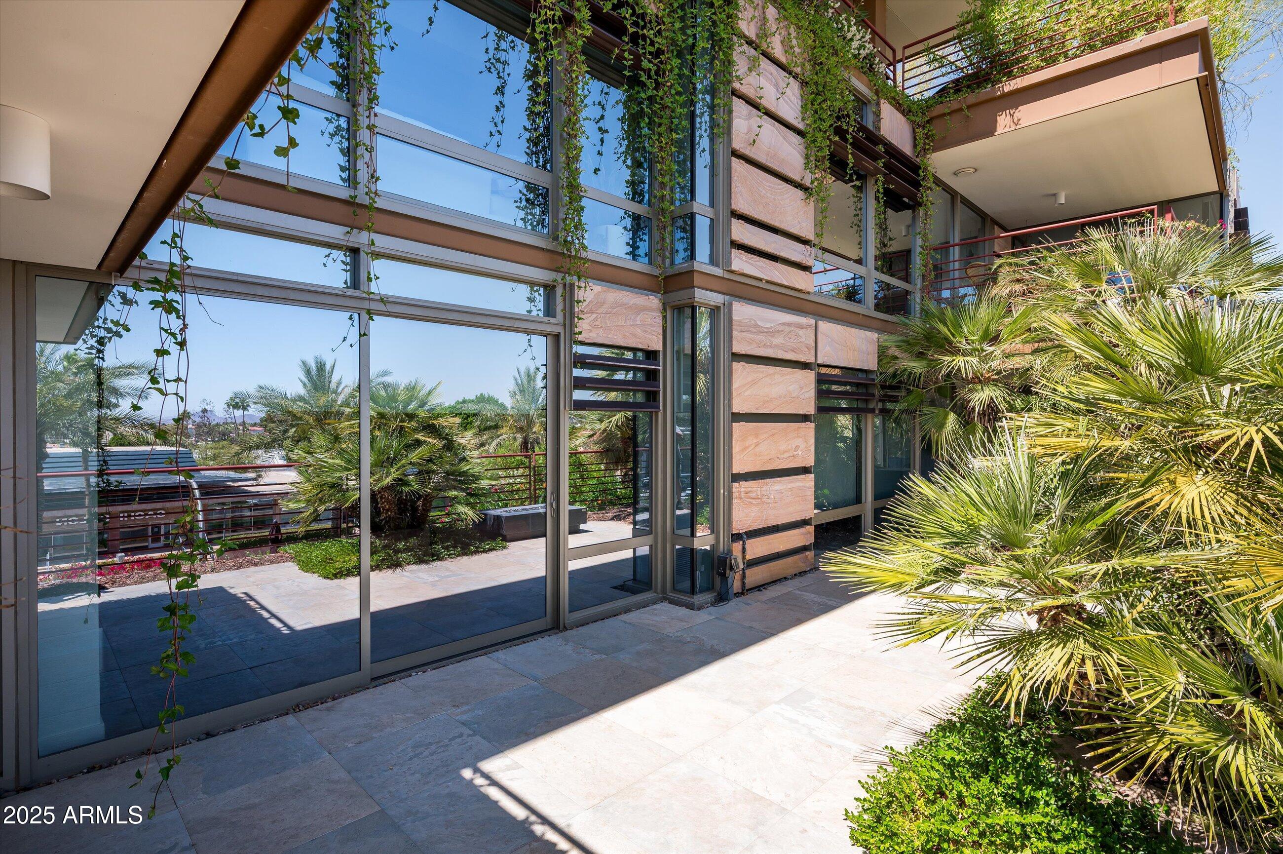 7167 East Rancho Vista Drive, Unit 4010 Scottsdale, AZ 85251 - Photo 23 of 43 a view of a porch with a door