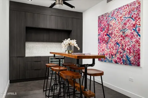 a view of a dining room with furniture and chandelier