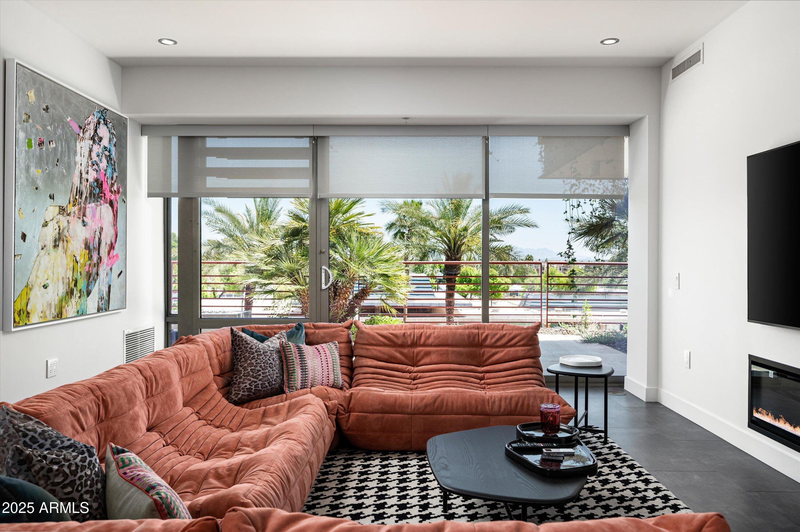 7167 East Rancho Vista Drive, Unit 4010 Scottsdale, AZ 85251 - Photo 7 of 43 a living room with furniture a rug and a window