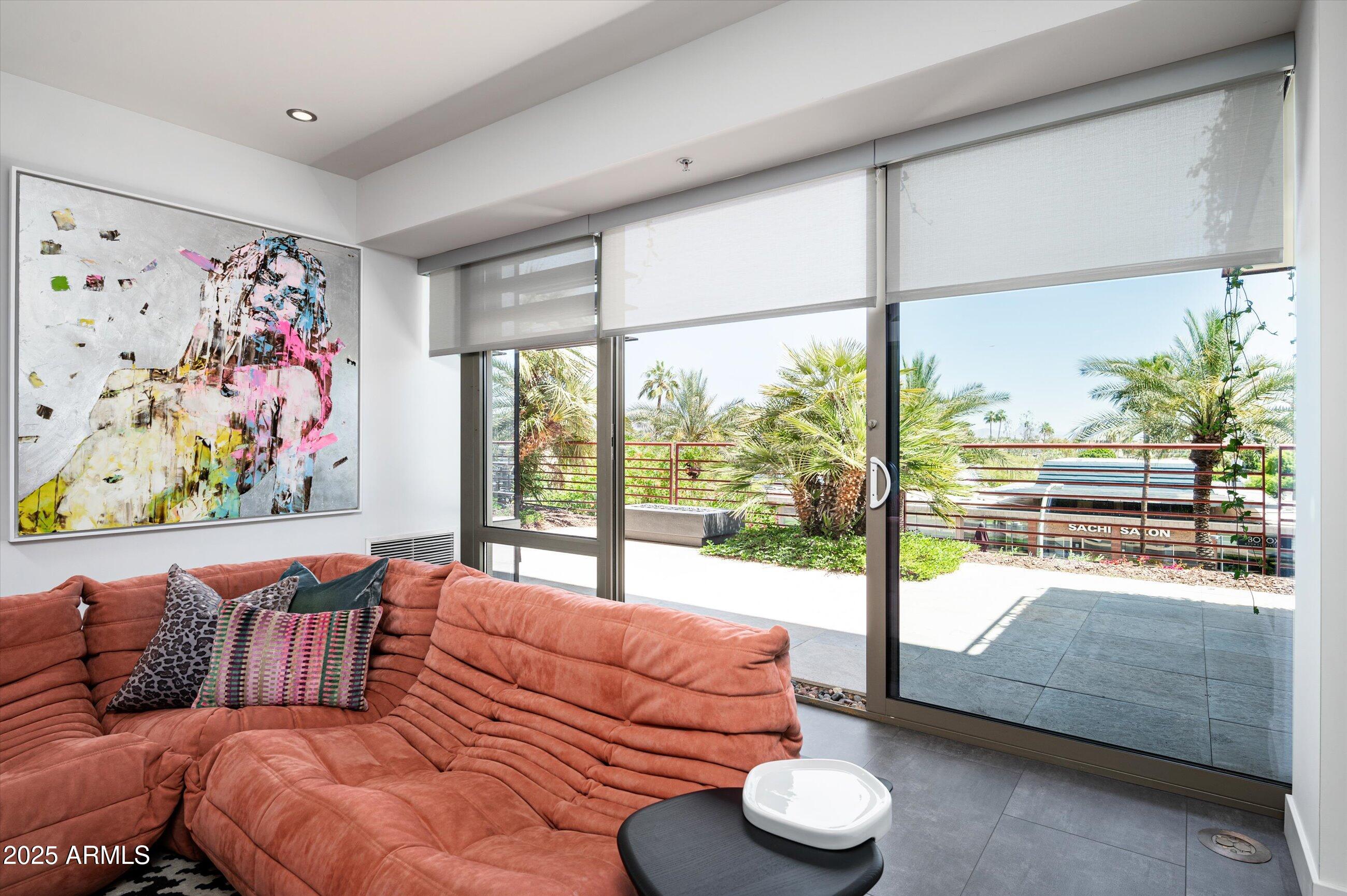 7167 East Rancho Vista Drive, Unit 4010 Scottsdale, AZ 85251 - Photo 8 of 43 a living room with furniture and a large window