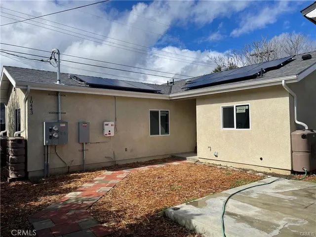 a house with trees in the background