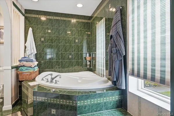 a bathroom with a bathtub and shower