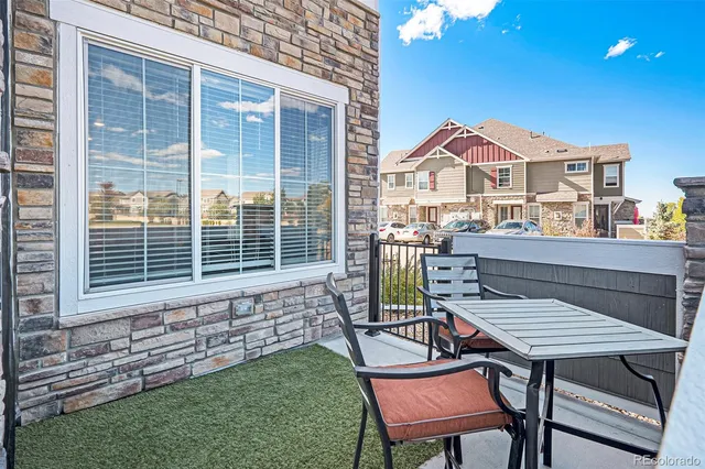a view of a house with a deck and a chair