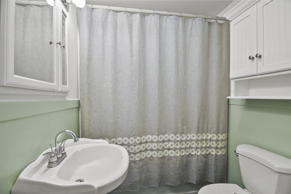 194 Fitchburg Road Townsend, MA 01469 - Photo 15 of 30 a bathroom with a sink a toilet and shower