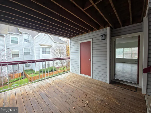 a view of balcony with wooden floor