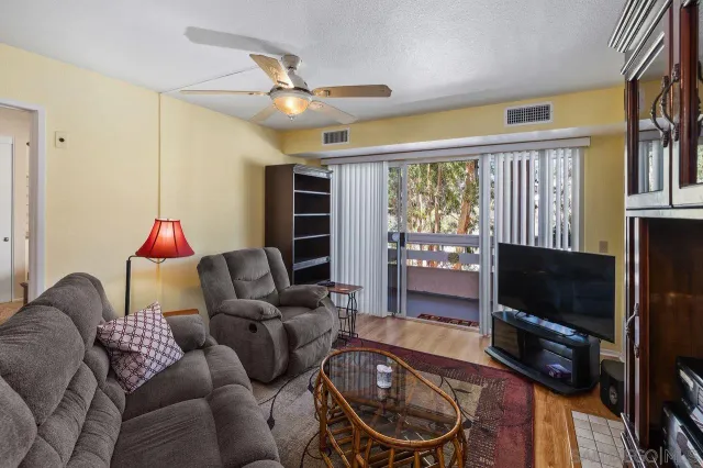 a kitchen with stainless steel appliances granite countertop a refrigerator and a stove