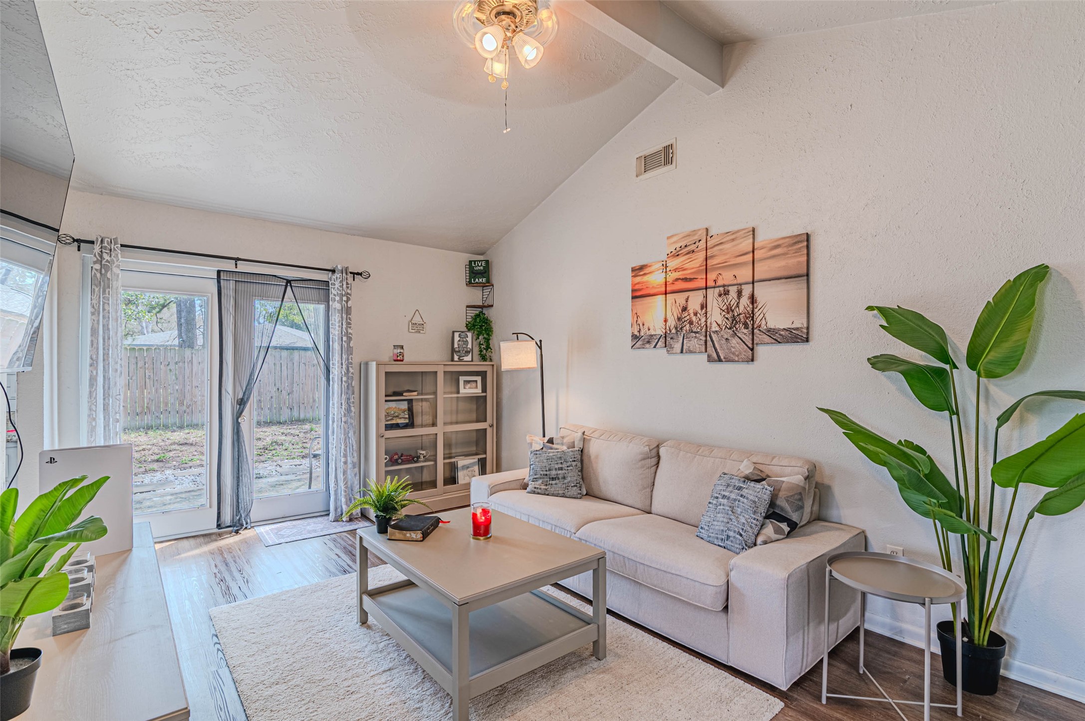 4606 Fitzwater Drive Spring, TX 77373 - Photo 11 of 42 a living room with furniture a chandelier and a potted plant