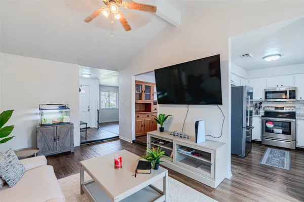 a view of a dining room with furniture and window