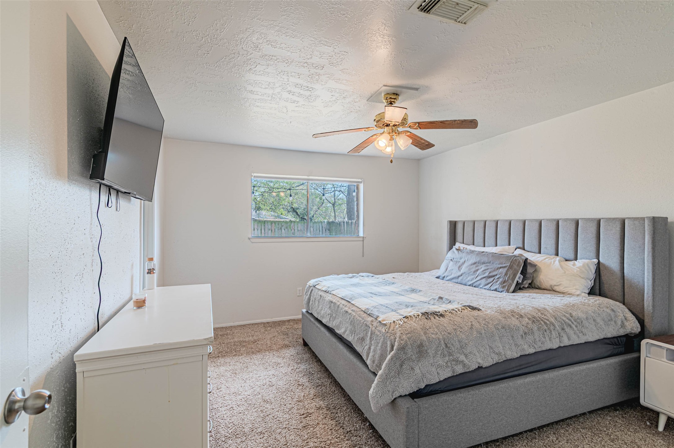 4606 Fitzwater Drive Spring, TX 77373 - Photo 25 of 42 a bedroom with a bed and a flat screen tv