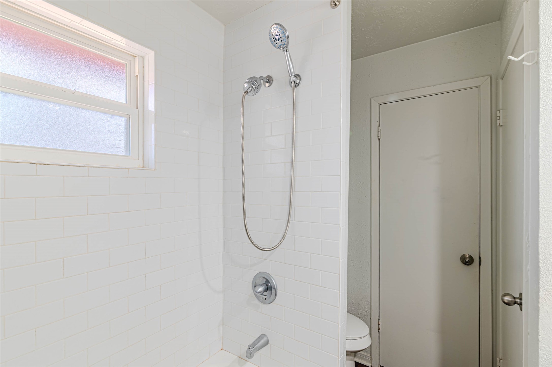 4606 Fitzwater Drive Spring, TX 77373 - Photo 32 of 42 a bathroom with a glass shower door