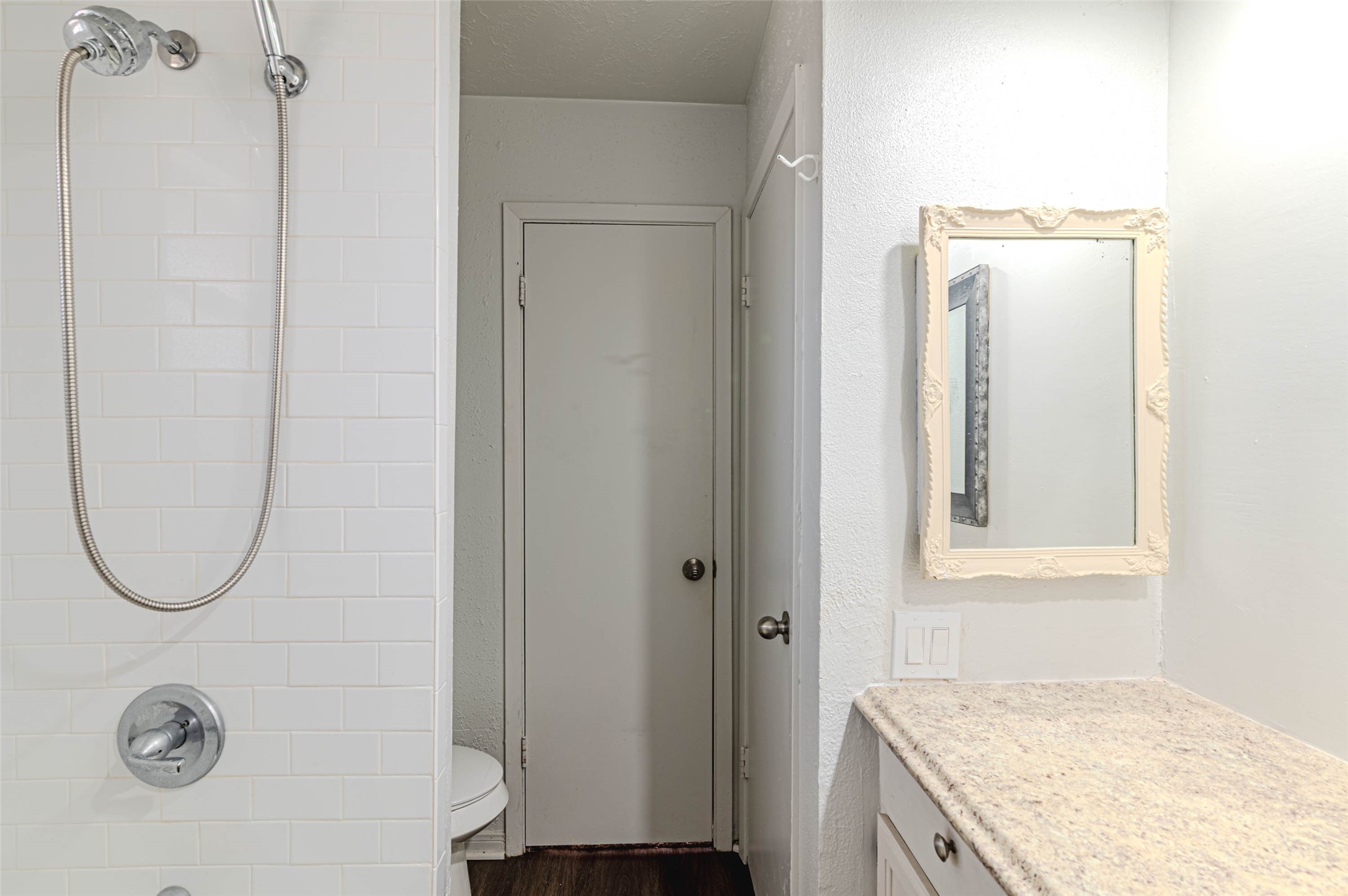 4606 Fitzwater Drive Spring, TX 77373 - Photo 33 of 42 a bathroom with a granite countertop mirror and a shower