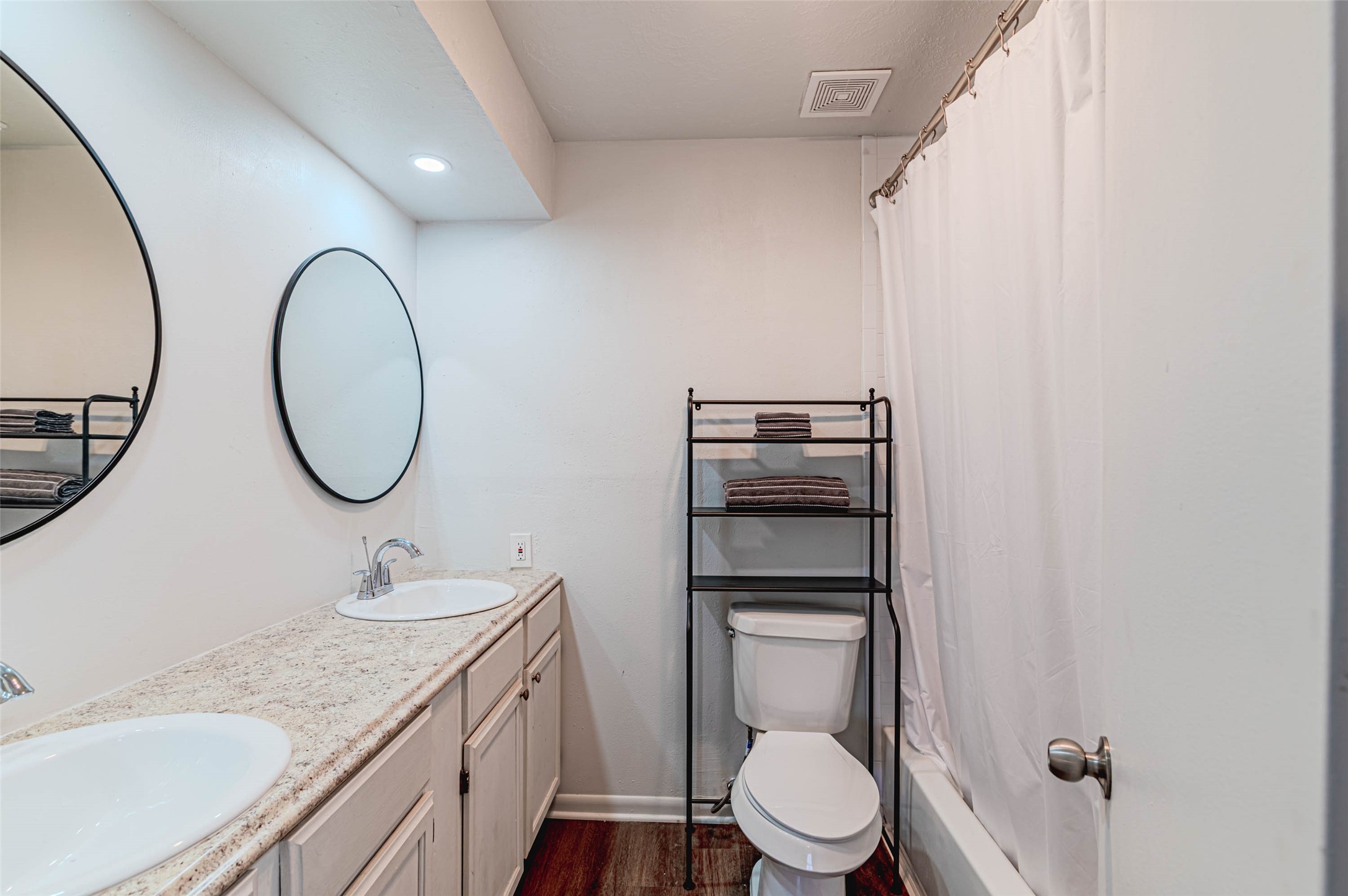 4606 Fitzwater Drive Spring, TX 77373 - Photo 36 of 42 a spacious bathroom with a granite countertop toilet sink and mirror