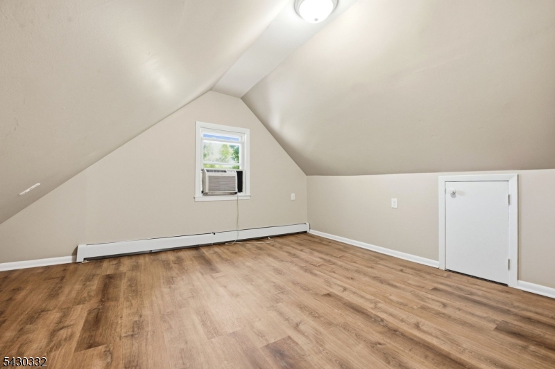 164 South Ridgewood Road South Orange, NJ 07079 - Photo 15 of 20 an empty room with wooden floor and windows