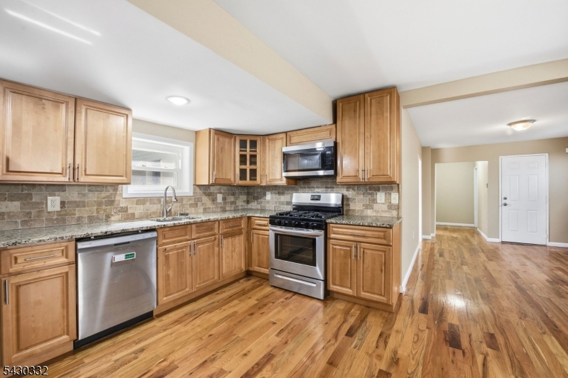 164 South Ridgewood Road South Orange, NJ 07079 - Photo 7 of 20 a kitchen with granite countertop cabinets stainless steel appliances and a sink