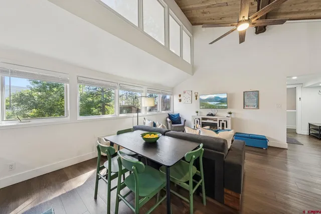 a view of a dining room with furniture window and wooden floor