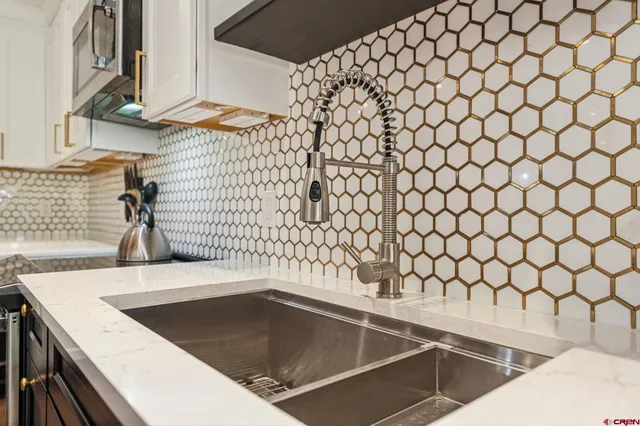 a kitchen with a sink and cabinets