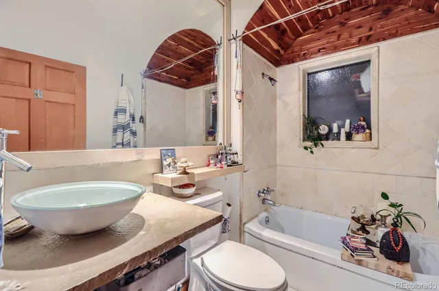 a bedroom with a bed and a closet