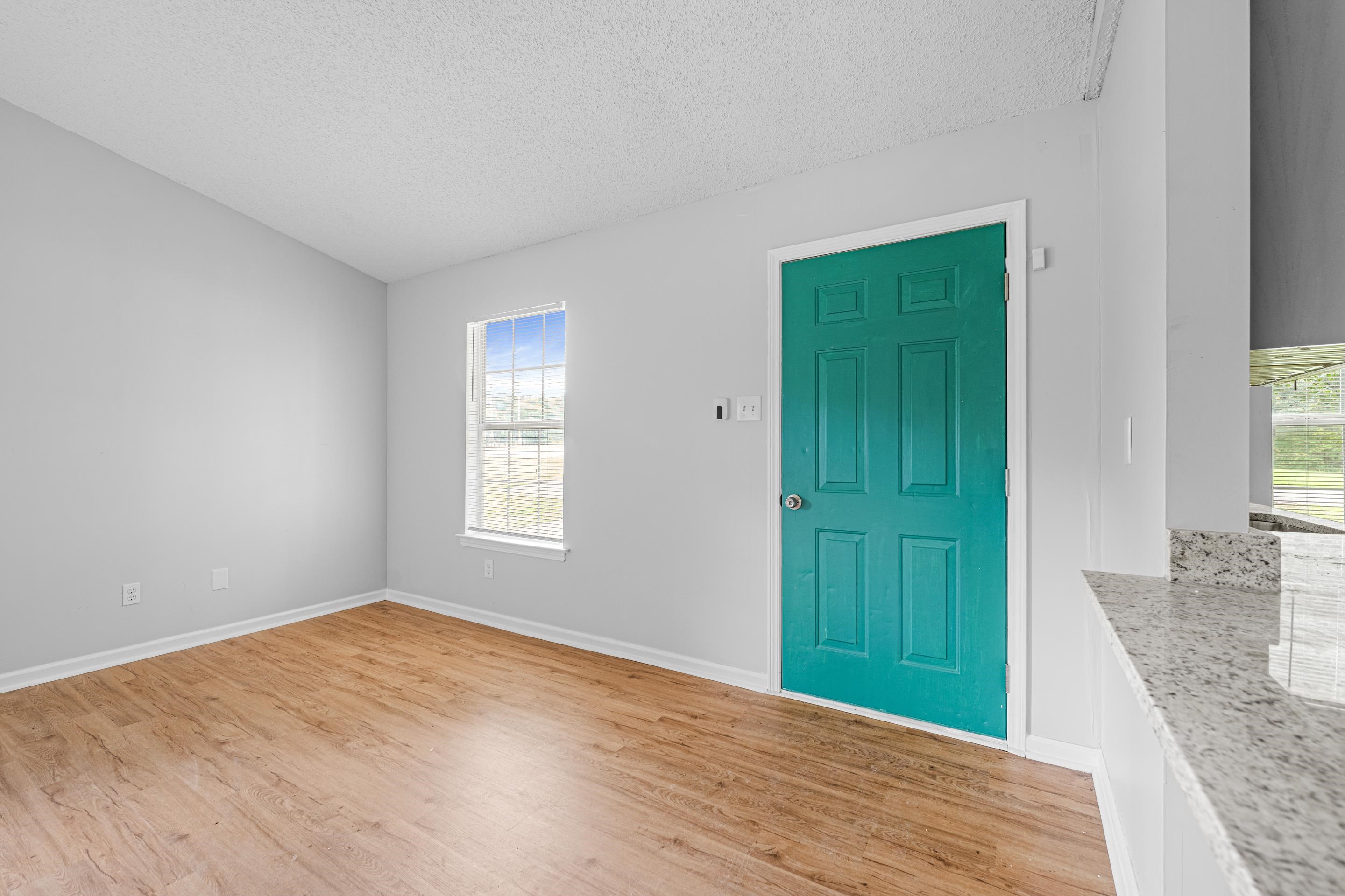 3879 Windermere Road Memphis, TN 38128 - Photo 3 of 20 a view of an empty room with closet and a window