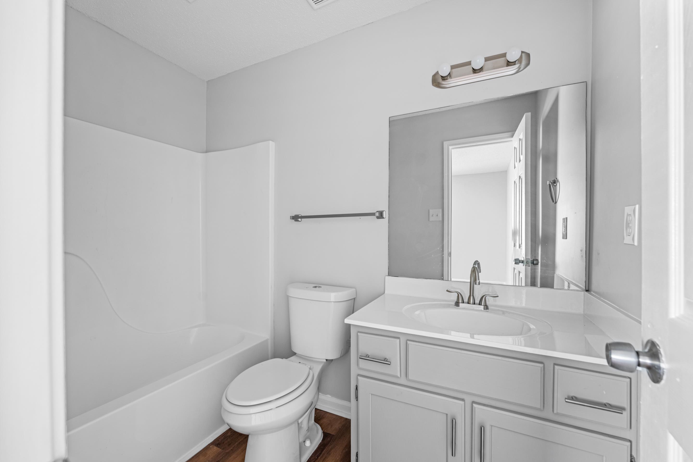 3879 Windermere Road Memphis, TN 38128 - Photo 6 of 20 a bathroom with a sink toilet and a mirror