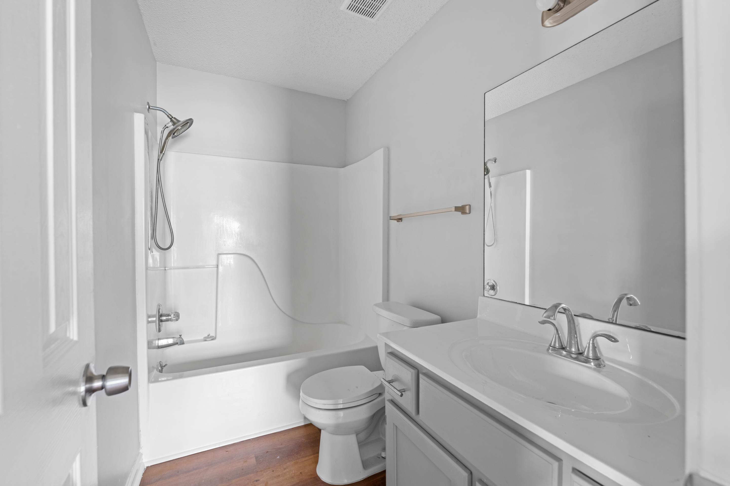 3879 Windermere Road Memphis, TN 38128 - Photo 7 of 20 a bathroom with a sink a toilet and shower
