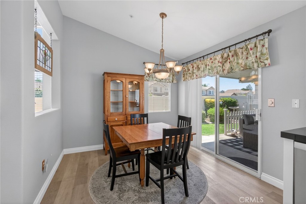 19584 Jill Court Riverside, CA 92508 - Photo 12 of 31 a view of a dining room with furniture window and wooden floor