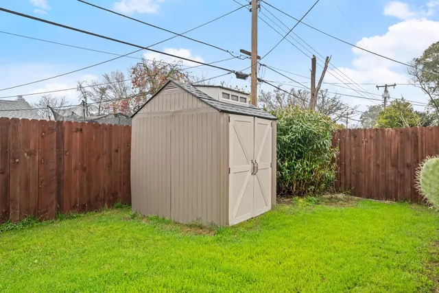 view of a backyard with wooden fence