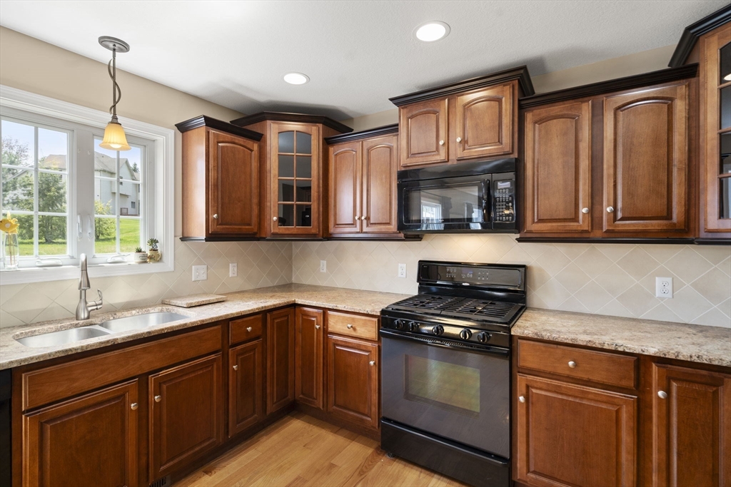161 Bear Hole Road West Springfield, MA 01089 - Photo 11 of 35 a kitchen with granite countertop stainless steel appliances a stove sink and microwave