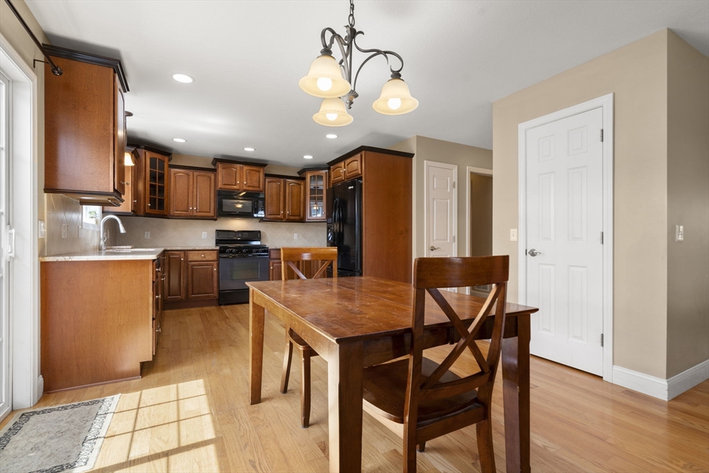 161 Bear Hole Road West Springfield, MA 01089 - Photo 14 of 35 a view of a dining room with furniture and a chandelier