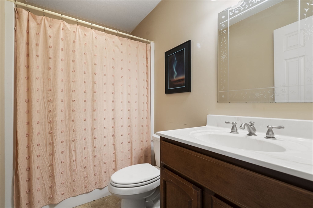 161 Bear Hole Road West Springfield, MA 01089 - Photo 23 of 35 a bathroom with a sink a toilet and a mirror