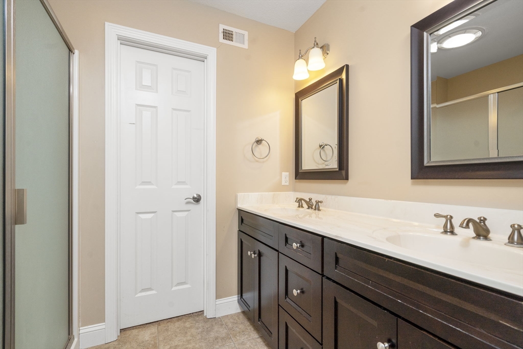 161 Bear Hole Road West Springfield, MA 01089 - Photo 28 of 35 a bathroom with a double vanity sink and mirror