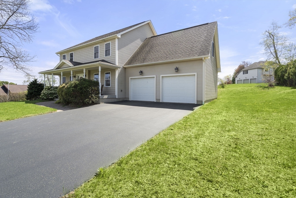 161 Bear Hole Road West Springfield, MA 01089 - Photo 3 of 35 a front view of a house with a yard and garage