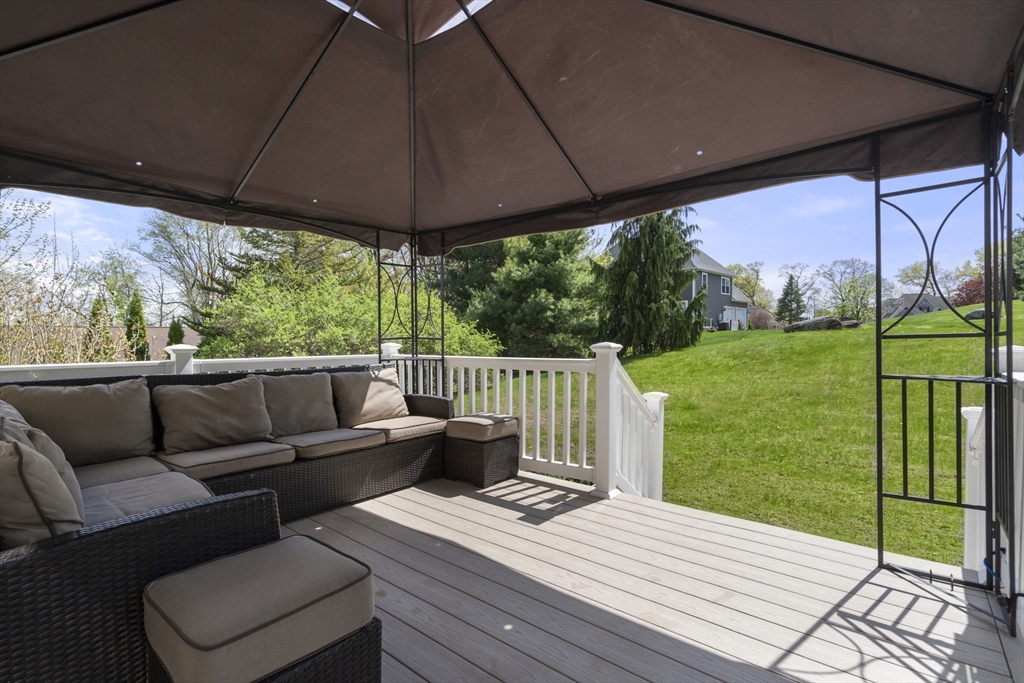 161 Bear Hole Road West Springfield, MA 01089 - Photo 32 of 35 a view of a patio with couches chairs under an umbrella
