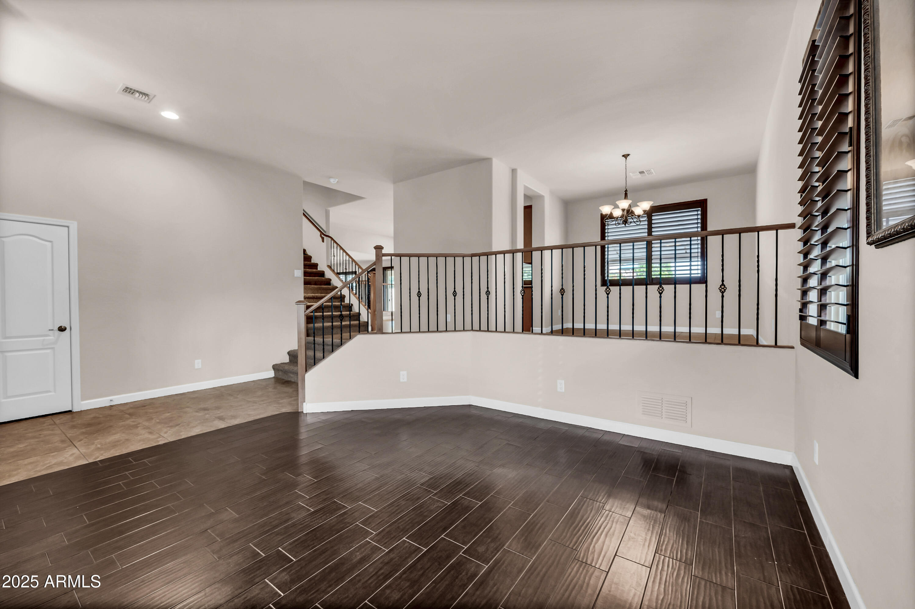 4587 South Ellesmere Street Gilbert, AZ 85297 - Photo 9 of 55 a view of entryway with wooden floor