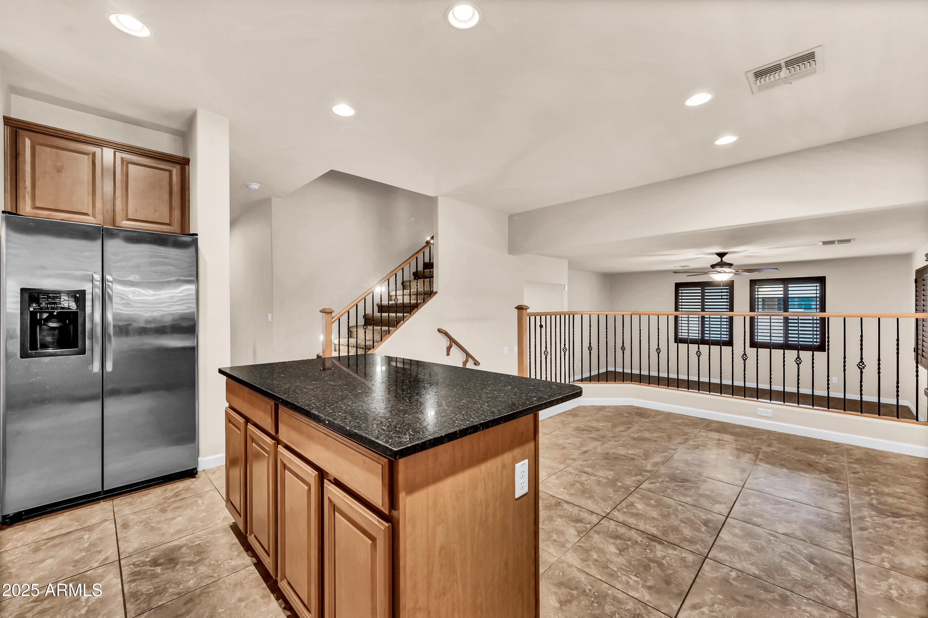 4587 South Ellesmere Street Gilbert, AZ 85297 - Photo 15 of 55 a kitchen with stainless steel appliances granite countertop a sink a refrigerator and a stove