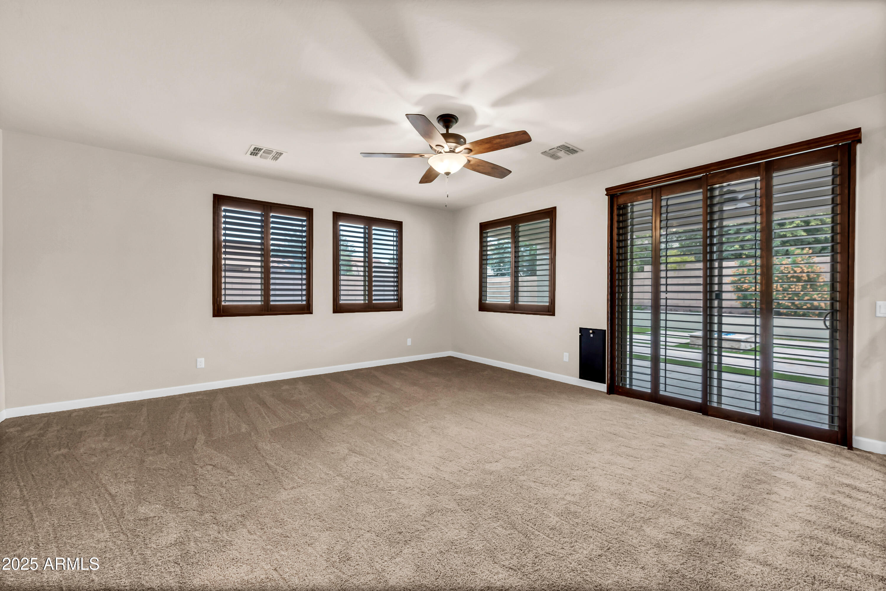 4587 South Ellesmere Street Gilbert, AZ 85297 - Photo 16 of 55 wooden floor in an empty room with a window