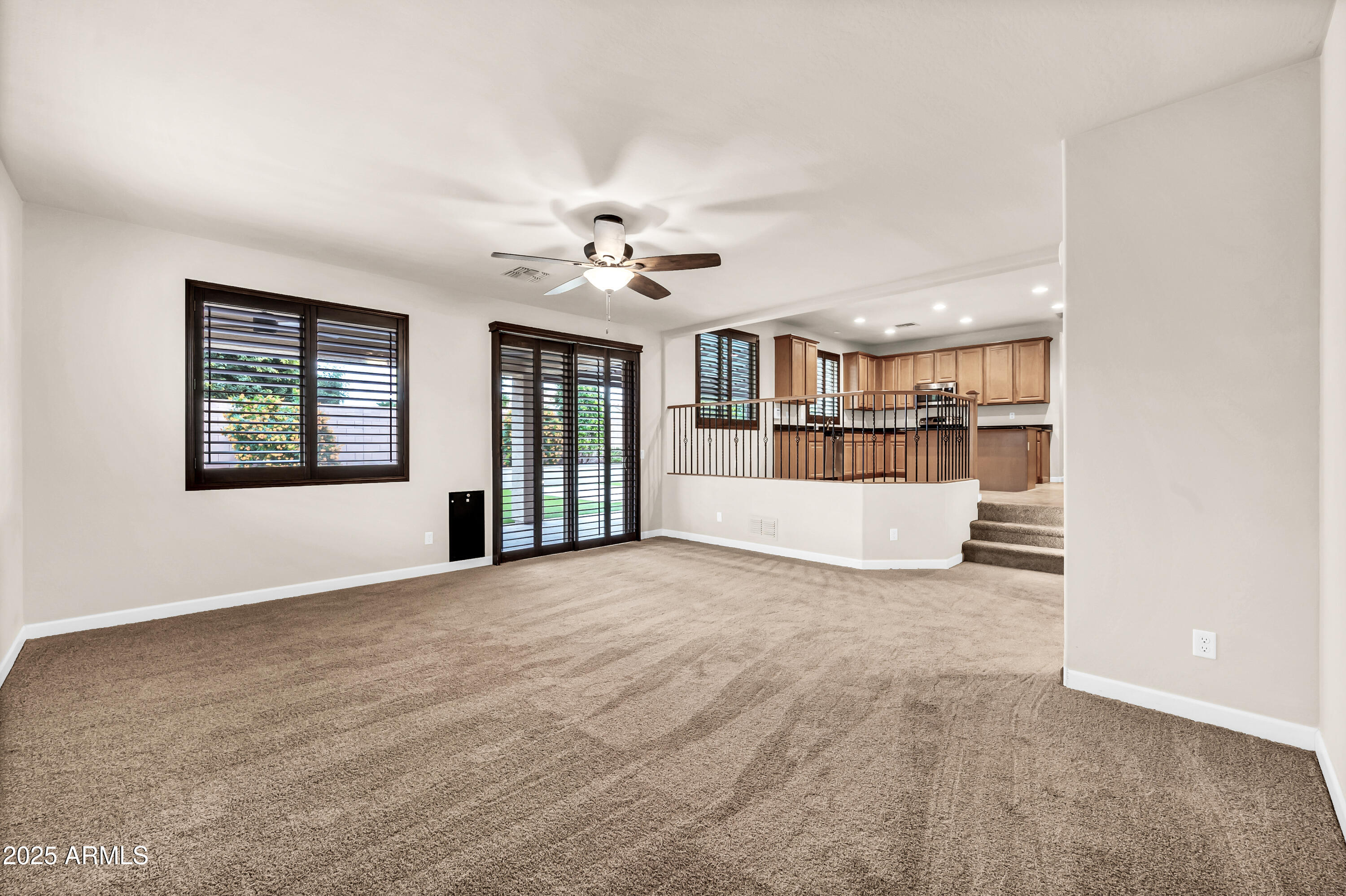 4587 South Ellesmere Street Gilbert, AZ 85297 - Photo 17 of 55 a view of an empty room with a window and a kitchen