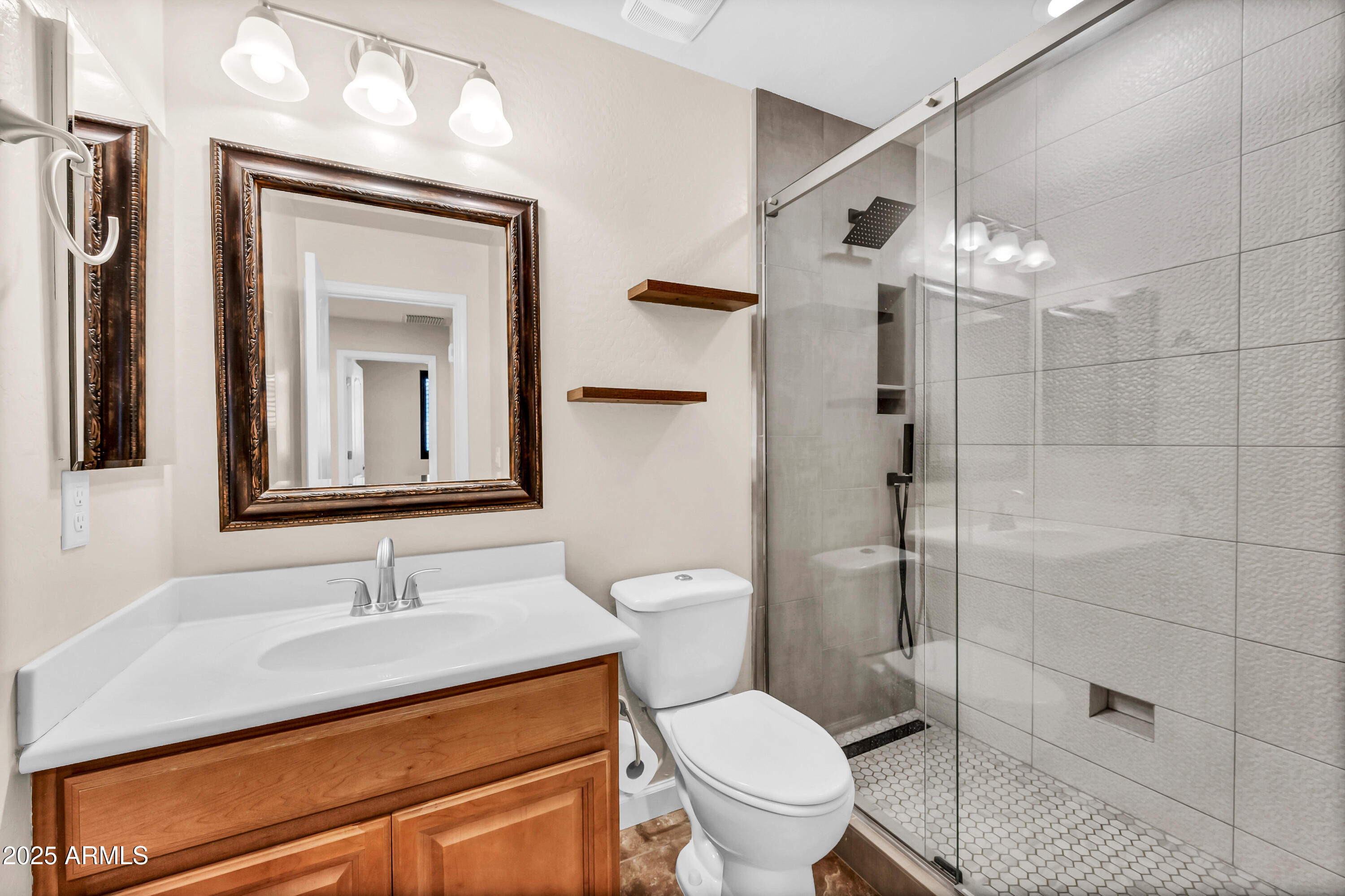 4587 South Ellesmere Street Gilbert, AZ 85297 - Photo 20 of 55 a bathroom with a sink toilet and shower
