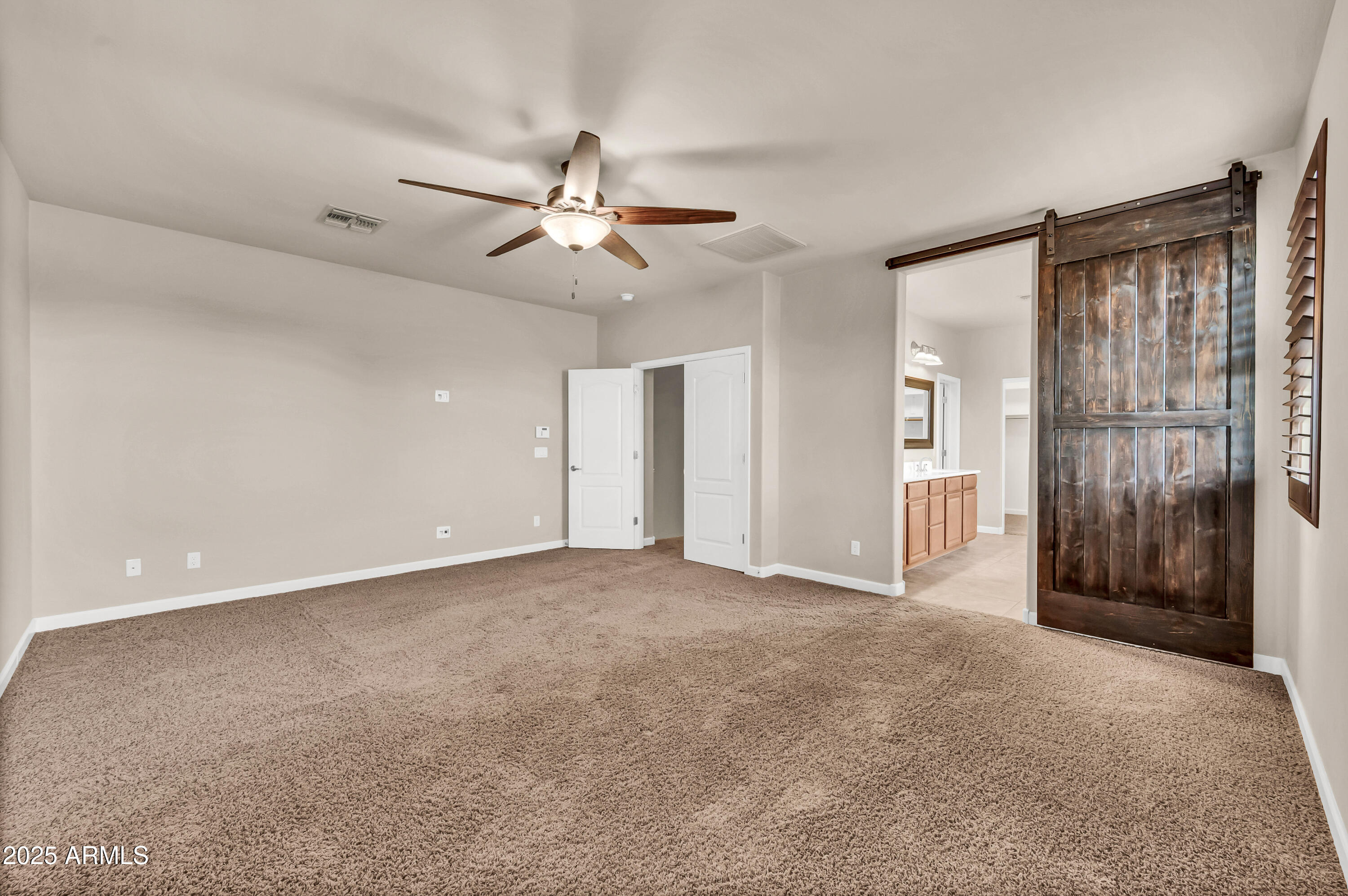 4587 South Ellesmere Street Gilbert, AZ 85297 - Photo 22 of 55 a view of an empty room with a window