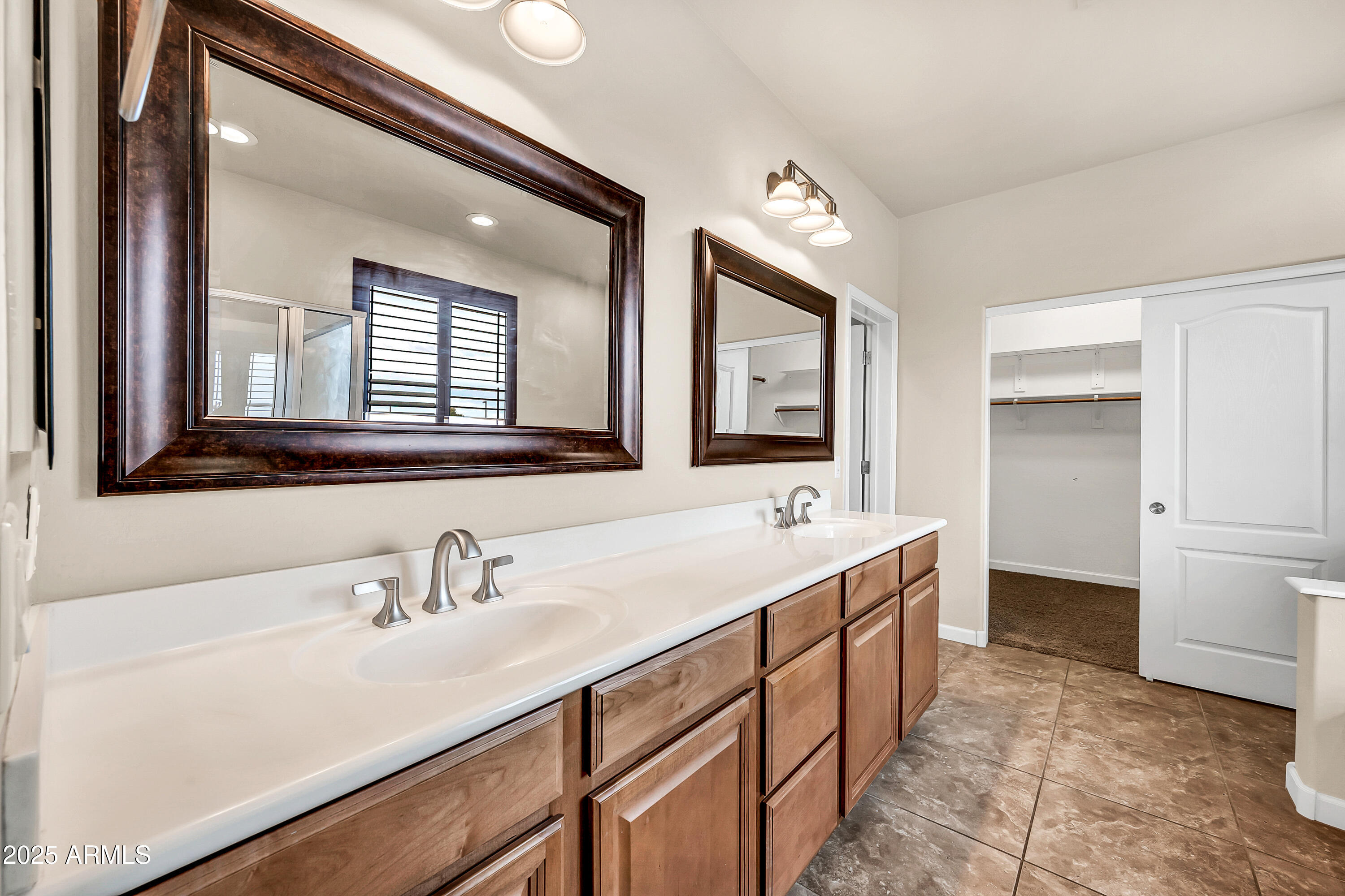 4587 South Ellesmere Street Gilbert, AZ 85297 - Photo 23 of 55 a bathroom with a sink and a mirror