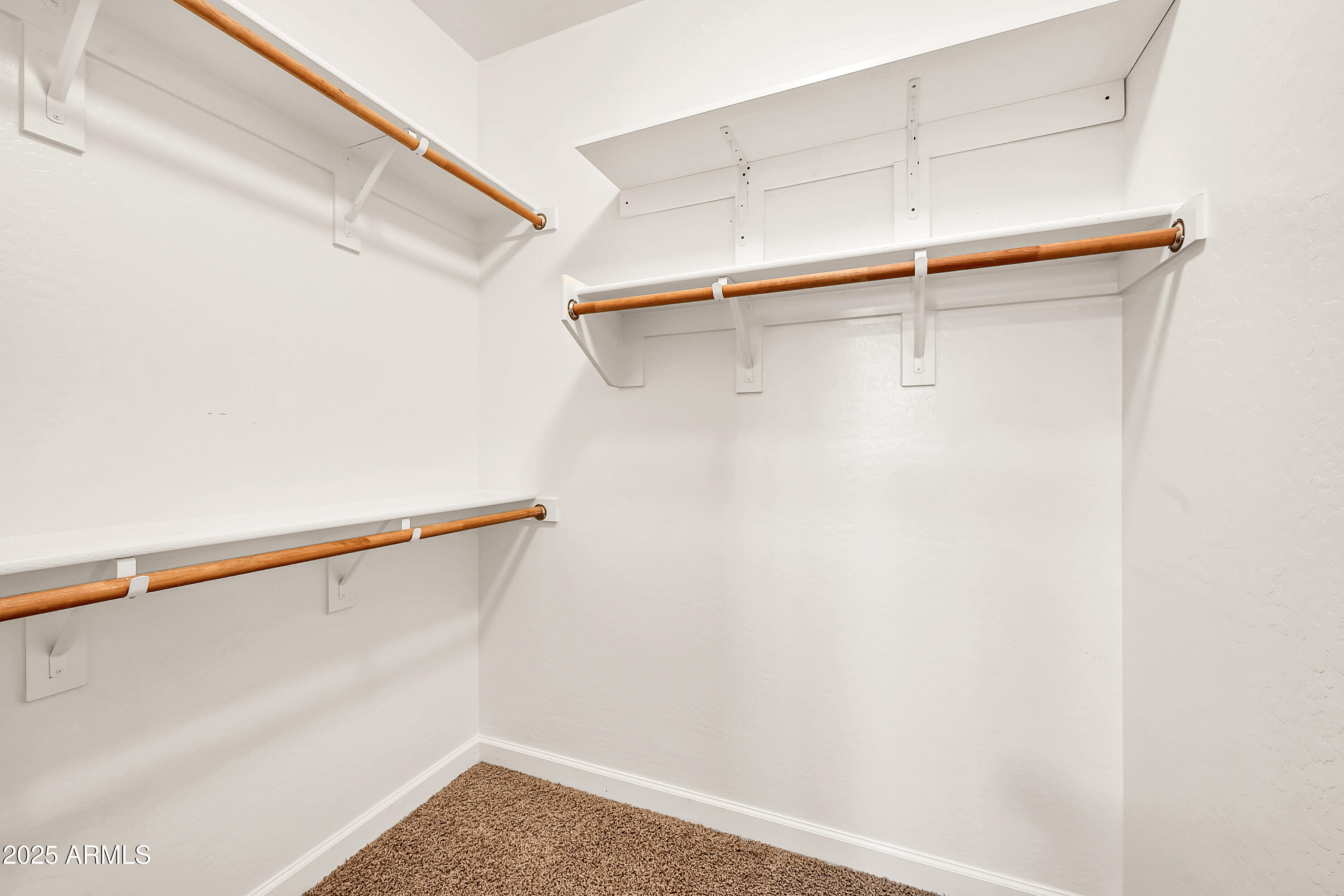 4587 South Ellesmere Street Gilbert, AZ 85297 - Photo 25 of 55 a view of a room with racks on the wall