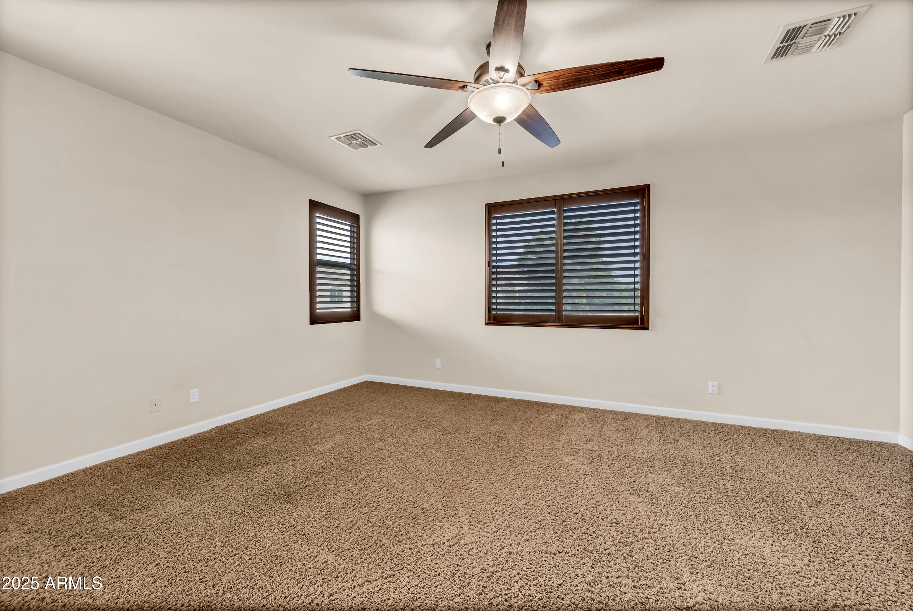 4587 South Ellesmere Street Gilbert, AZ 85297 - Photo 26 of 55 an empty room with windows and fan