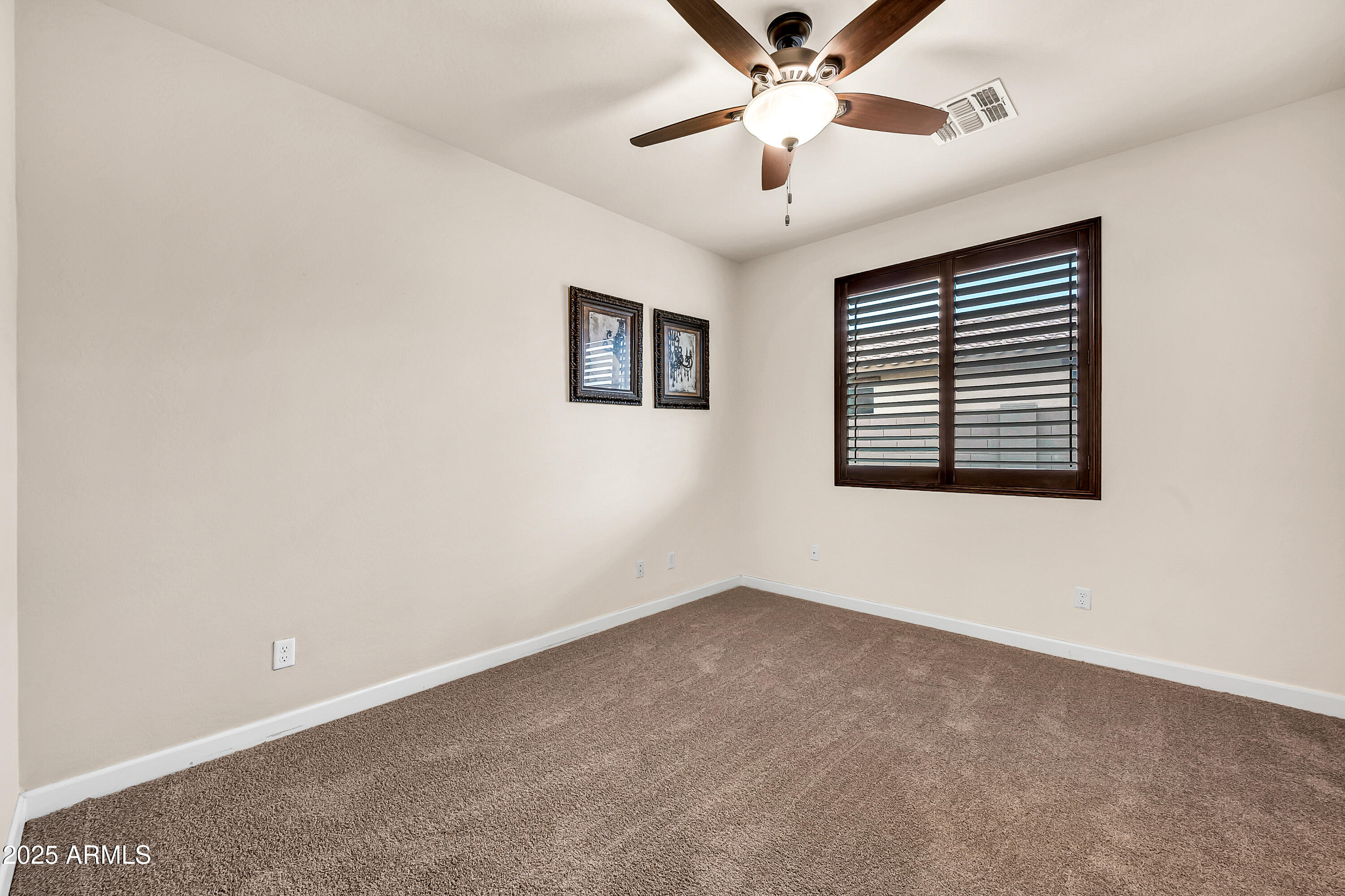 4587 South Ellesmere Street Gilbert, AZ 85297 - Photo 28 of 55 an empty room with windows and fan