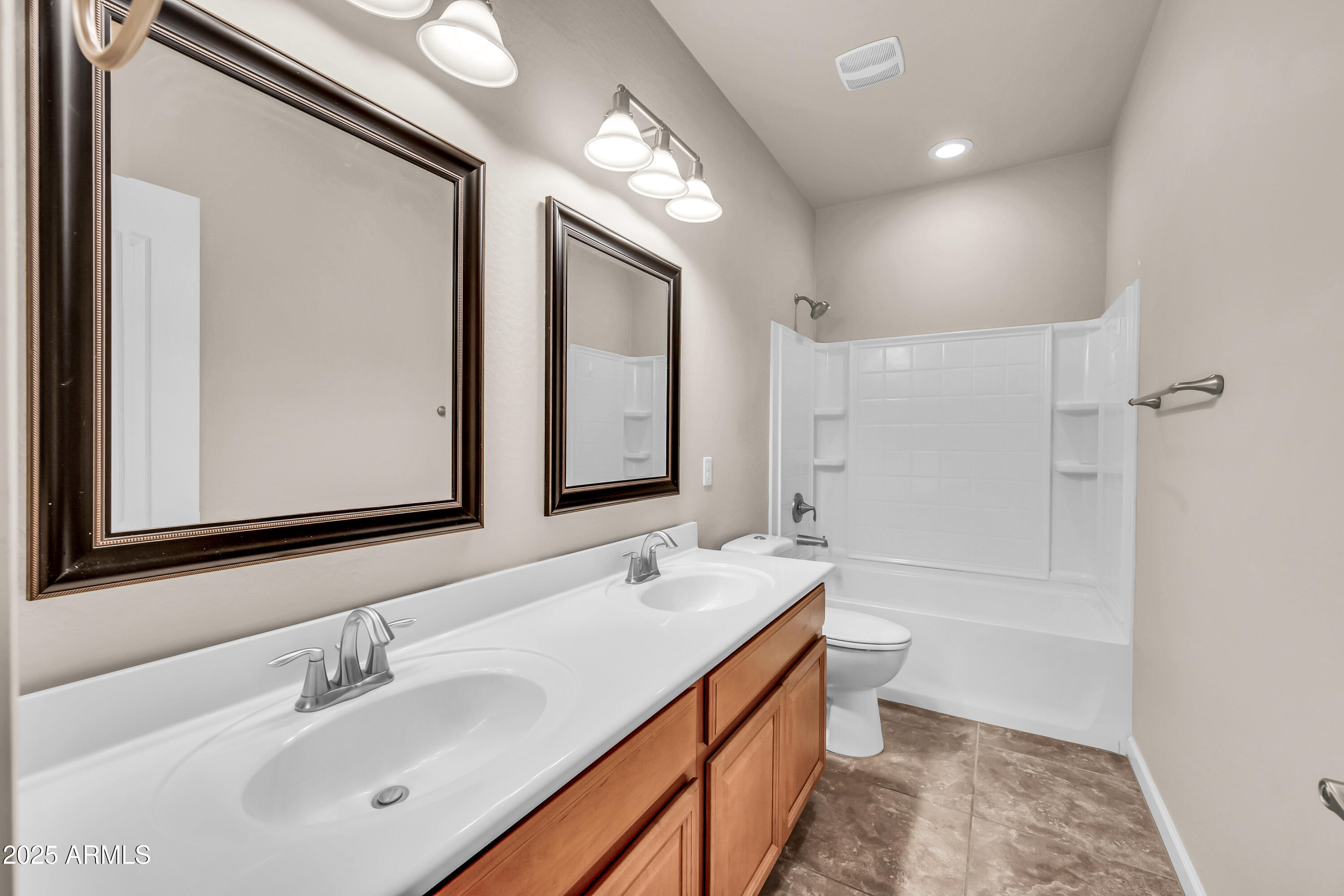 4587 South Ellesmere Street Gilbert, AZ 85297 - Photo 33 of 55 a bathroom with a double vanity sink and a mirror