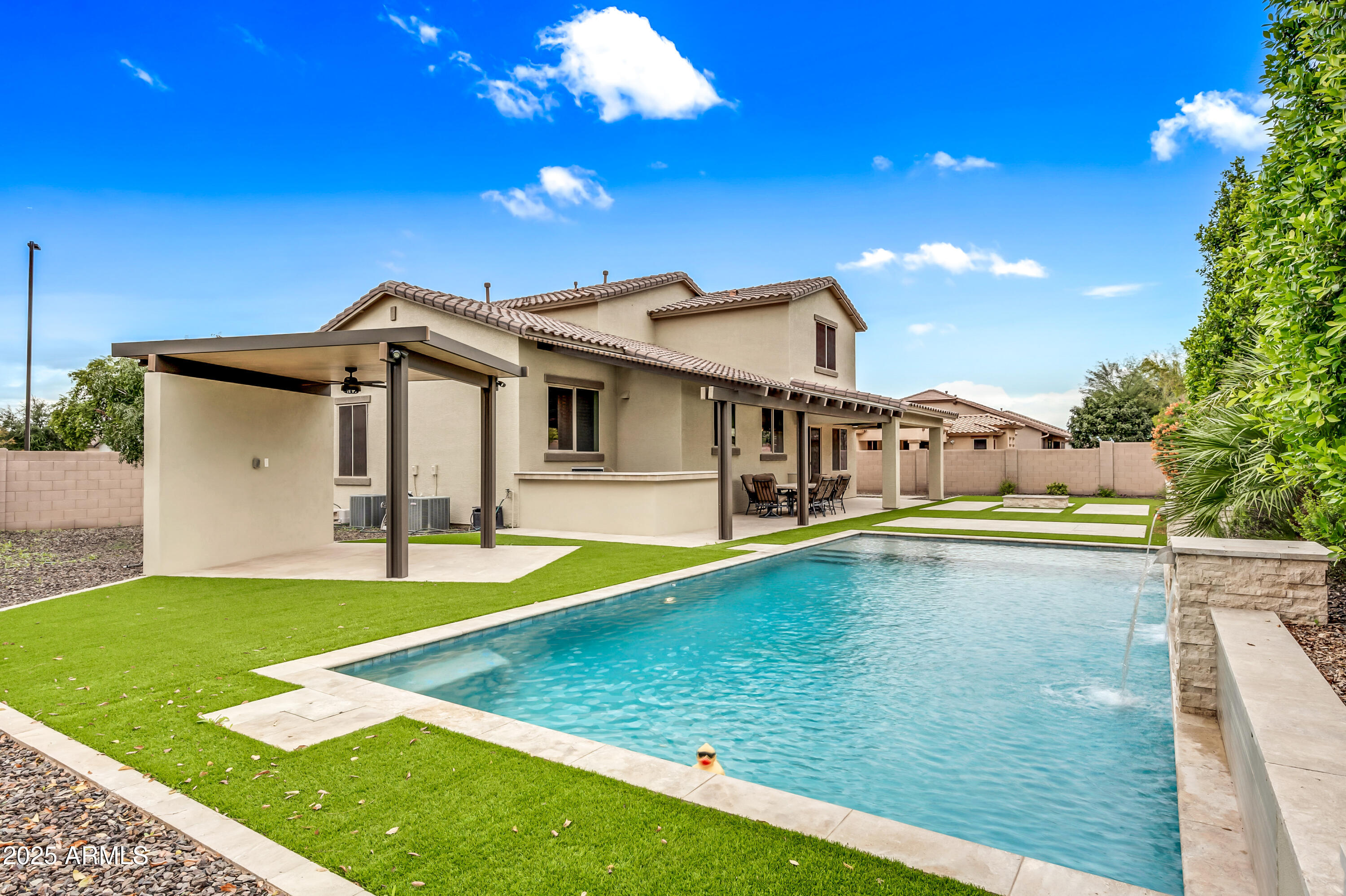 4587 South Ellesmere Street Gilbert, AZ 85297 - Photo 36 of 55 a view of an house with swimming pool and porch