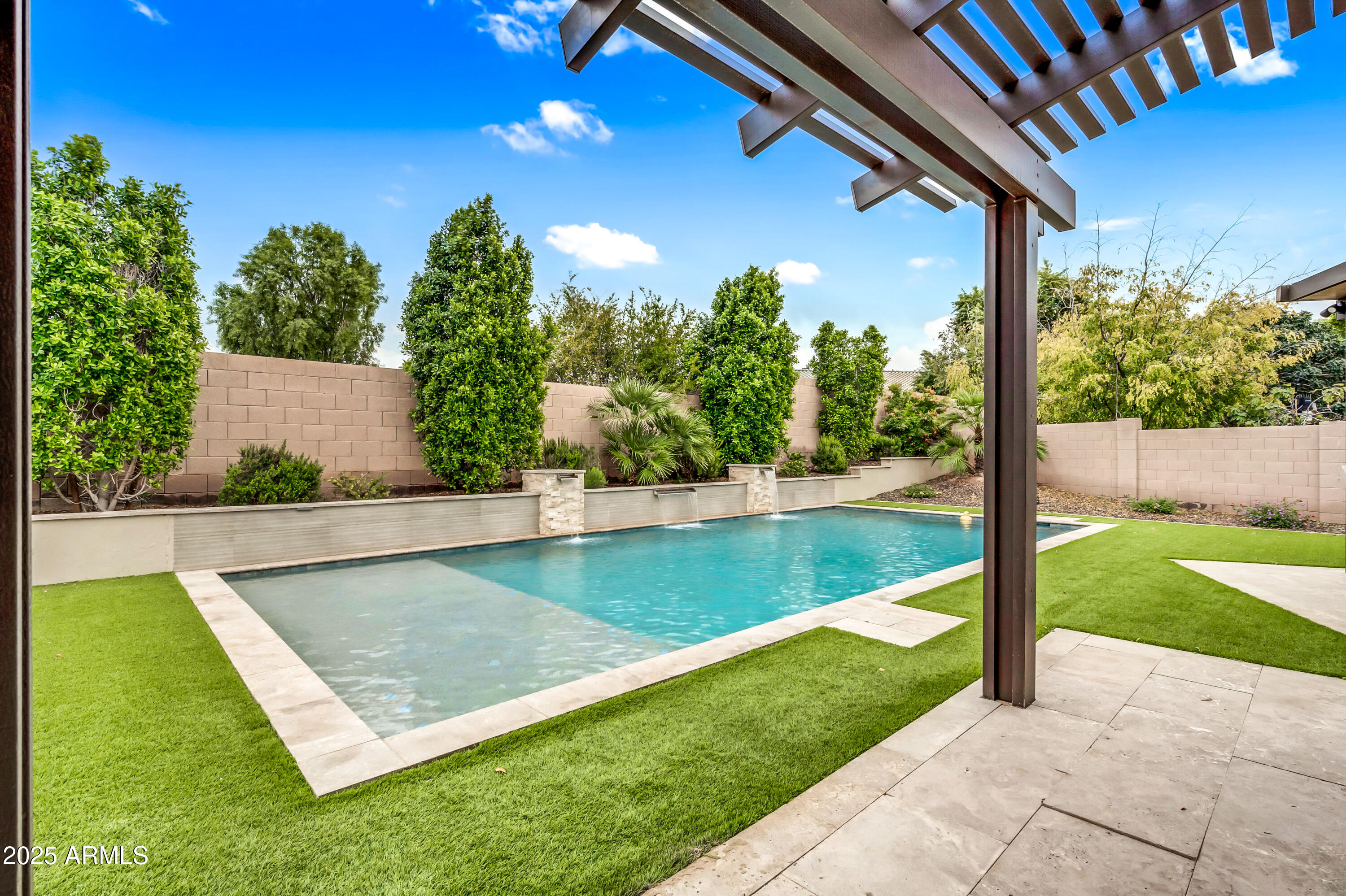 4587 South Ellesmere Street Gilbert, AZ 85297 - Photo 39 of 55 a view of a swimming pool with a yard