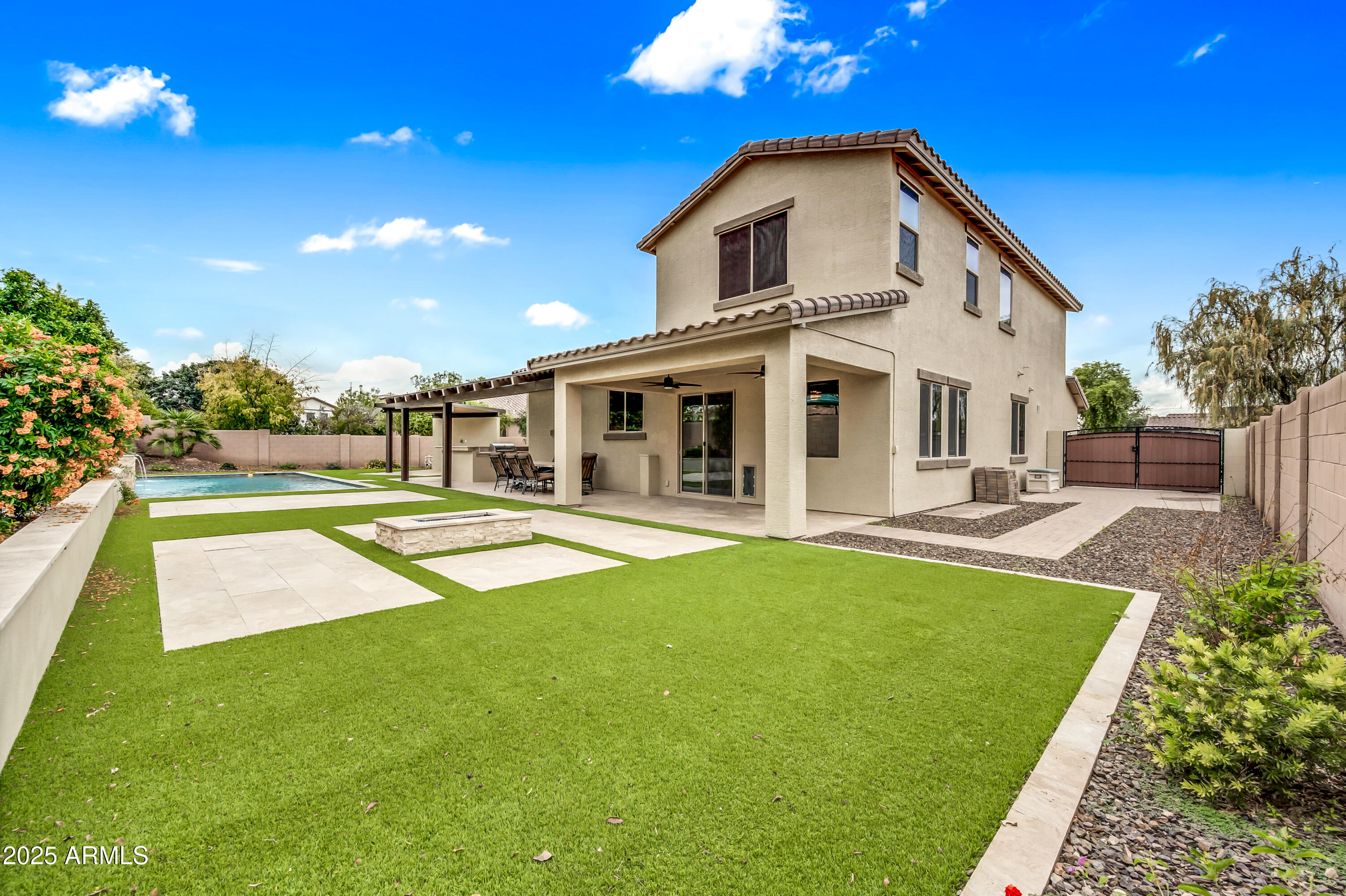 4587 South Ellesmere Street Gilbert, AZ 85297 - Photo 41 of 55 a swimming pool with outdoor seating and yard