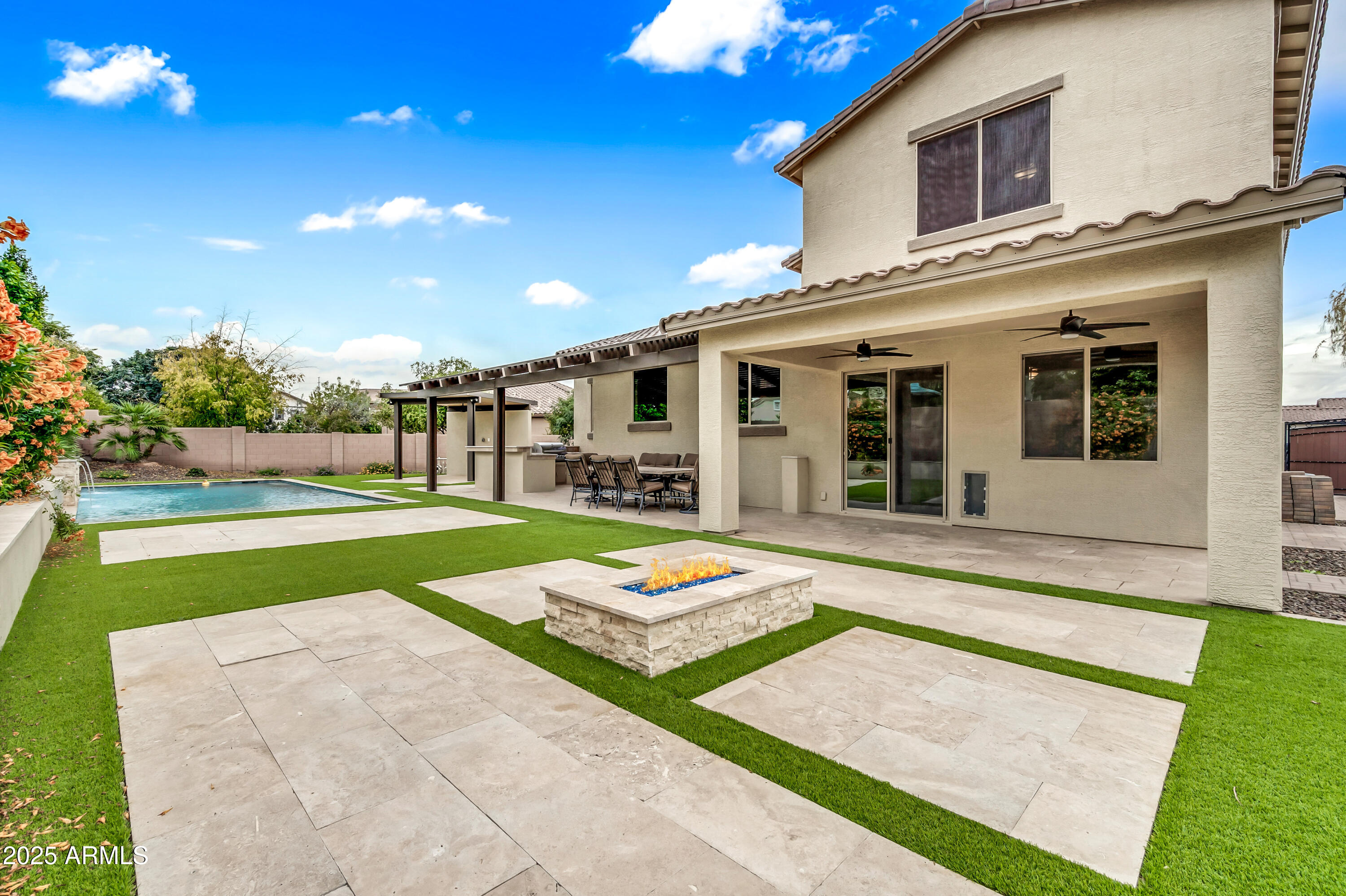 4587 South Ellesmere Street Gilbert, AZ 85297 - Photo 42 of 55 a front view of house with yard and outdoor seating