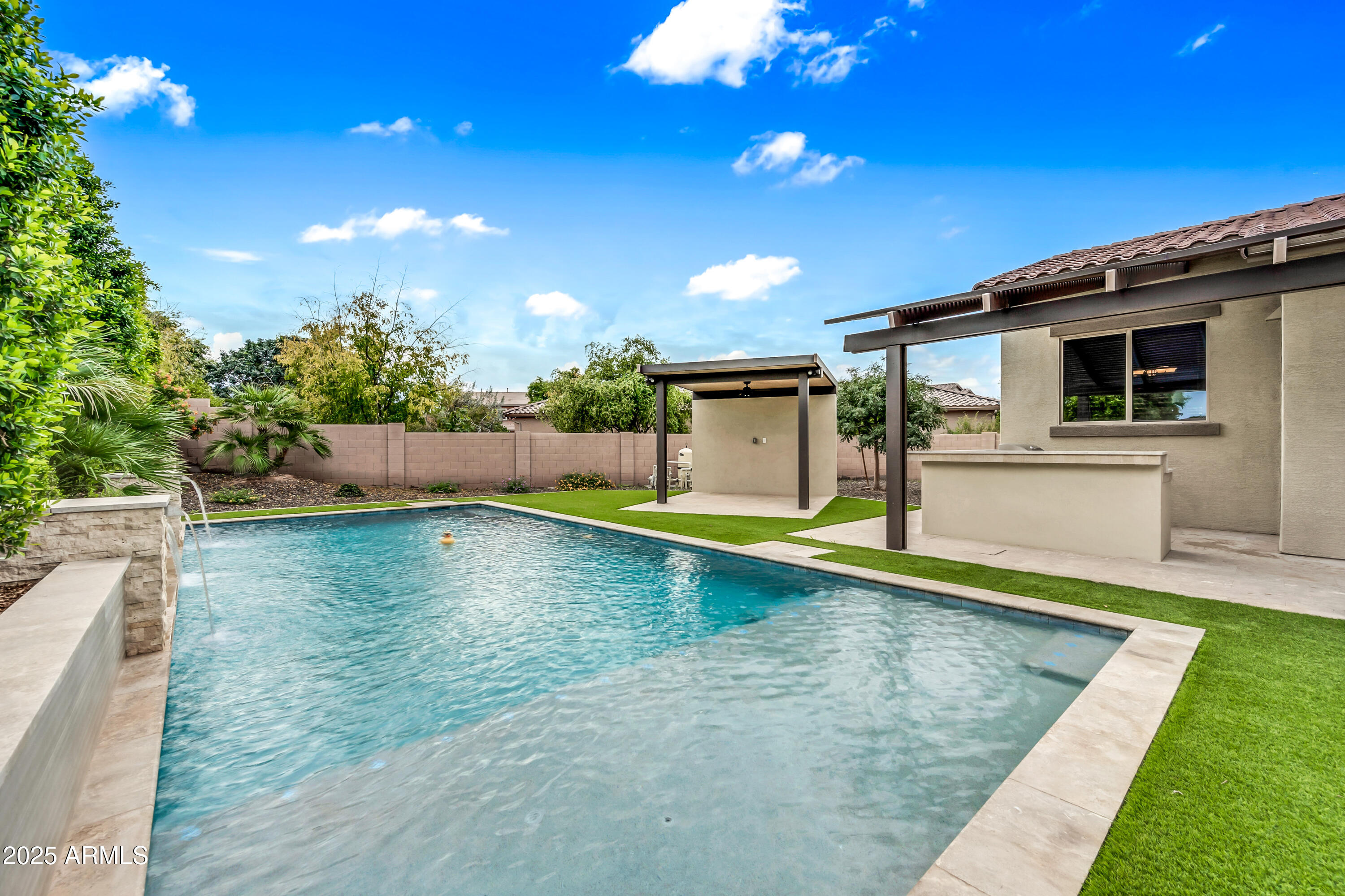4587 South Ellesmere Street Gilbert, AZ 85297 - Photo 45 of 55 a view of a backyard with swimming pool